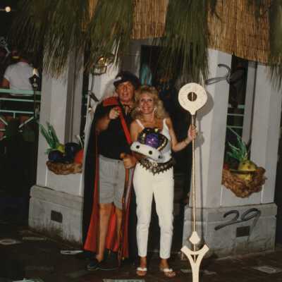 Two unknown people dressed up.