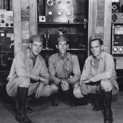 Servicemen Kneeling with Electronic Equipment