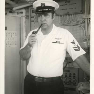 USCG man smoking a pipe