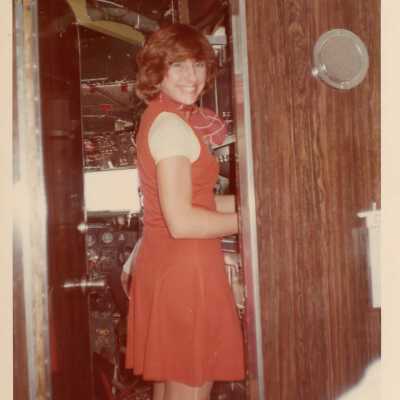 Unknown woman standing in a doorway of a control room