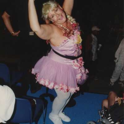 Unknown woman dressed up on a stage.