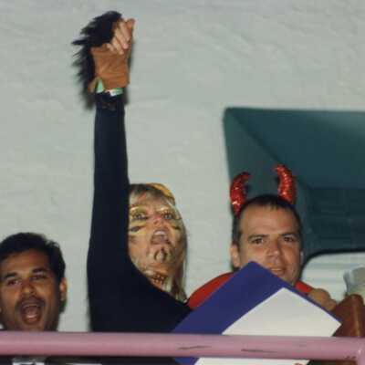 Unknown people, some are dressed up.