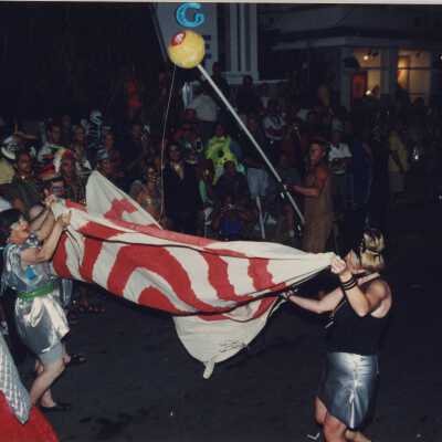 Unknown people walking in the parade.