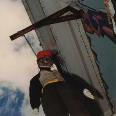 A doll hanging from the roof.