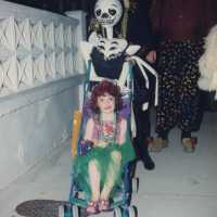 An unknown family dressed up walking.