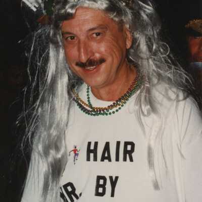 Unknown man with a wig on that is suppose to look like what it looked like after Hurricane Georges passed Key West.