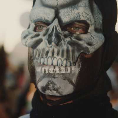 Unknown man wearing a mask.