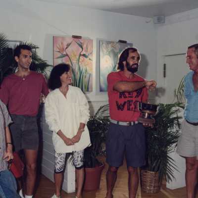 Unknown people talking at a ceremony.