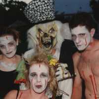 Four unknown people dressed up.