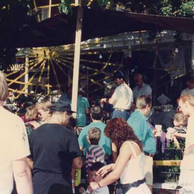 Unknown people standing near the Woman's Club.