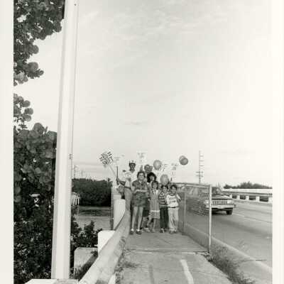 Unknown people holding election signs