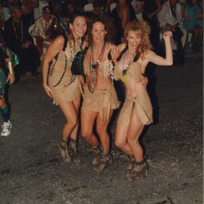 Three unknown woman dressed up.