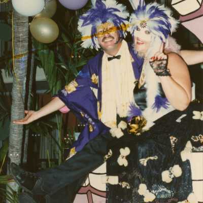 Two unknown people dressed up on a float.