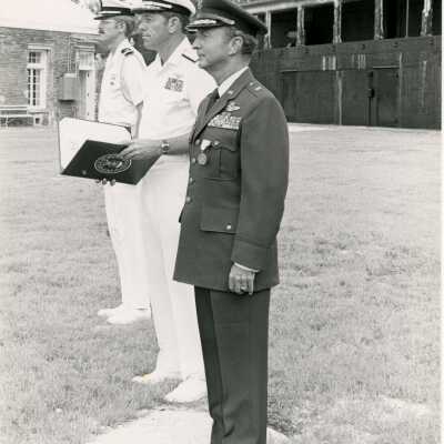 Unknown men in uniform standing outside