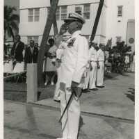 A man in uniform saluting