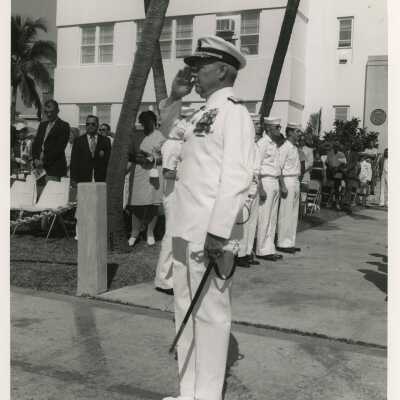 A man in uniform saluting