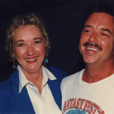 Unknown woman and man at the awards ceremony.