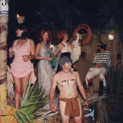 Unknown people dressed up on a float.