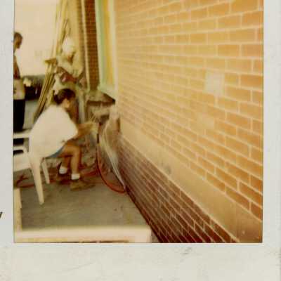 An woman working on the exterior.