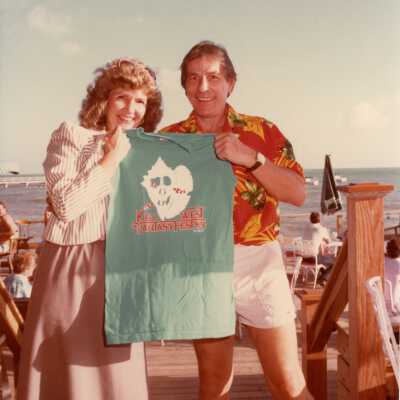 Two unknown people holding up a FF 84 t shirt.