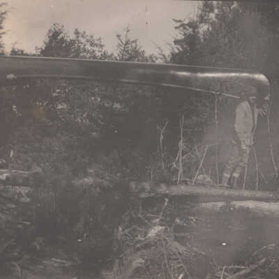 Unknown men with a canoe