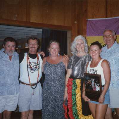 A group of unknown people at an awards ceremony.
