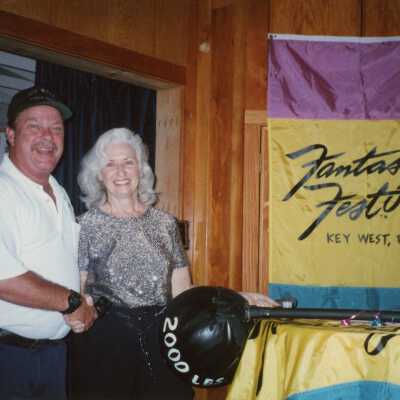 Unknown man and woman at an award ceremony.