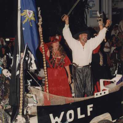 Unknown people dressed up on a float for the parade.