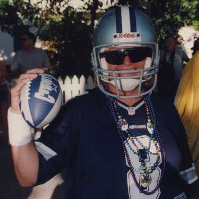 Unknown person dressed up as a football player.