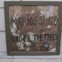 Mario’s Studio Under the Trees Sign