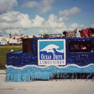 A float in the parade that reads Ocean Drive limousines.