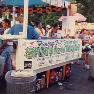Spirits from the Triangle Fantasy Fest street fair sign.