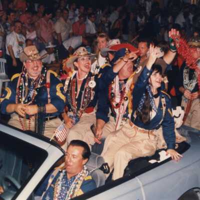 Unknown people dressed up on a float.