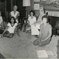 A group of ladies sitting in a living room
