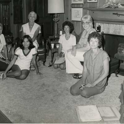 A group of ladies sitting in a living room
