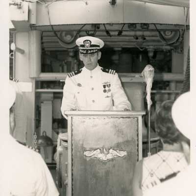An unknown man in uniform at the podium