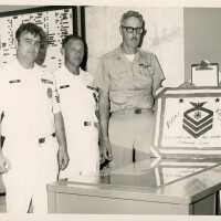 3 Unknown men in uniform at a farewell party