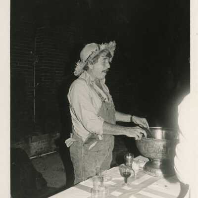 An unknown man dressed up as a scare crow