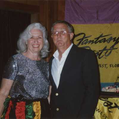 An unknown woman and man at an award ceremony.