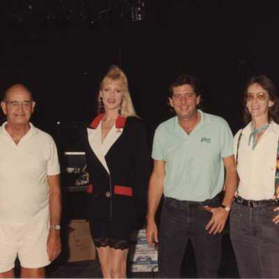 Unknown people standing.