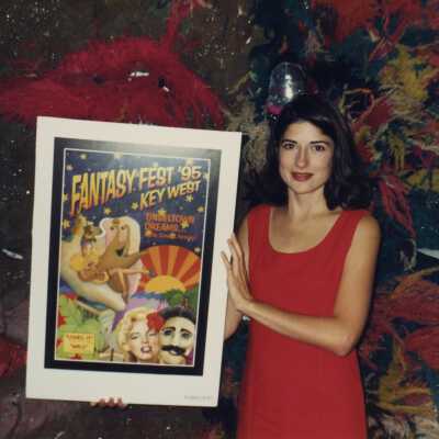 An unknown woman holding a FF 1995 poster.