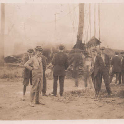 Boys, men, and damaged electrical equipment