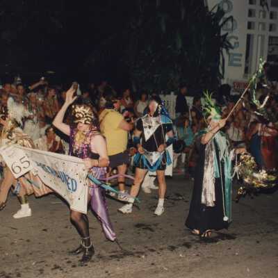 Unknown people walking in the street for the parade.
