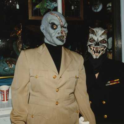 Two unknown people dressed up.