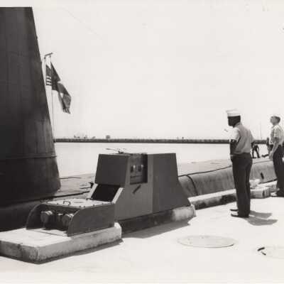 Sailors on a pier near a submarine