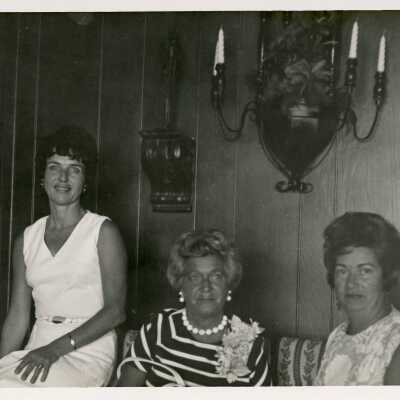 3 Unknown woman sitting in a living room