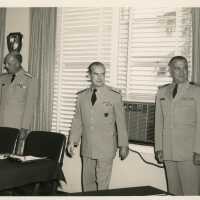 3 Men in uniform in an office