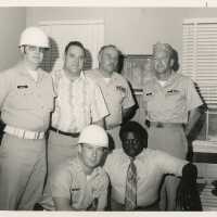 A group of unknown men in an office