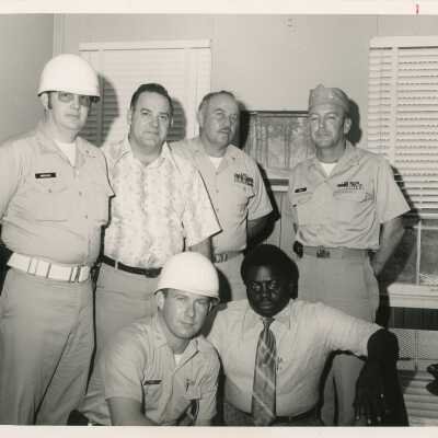 A group of unknown men in an office