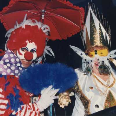 Two unknown people dressed up.